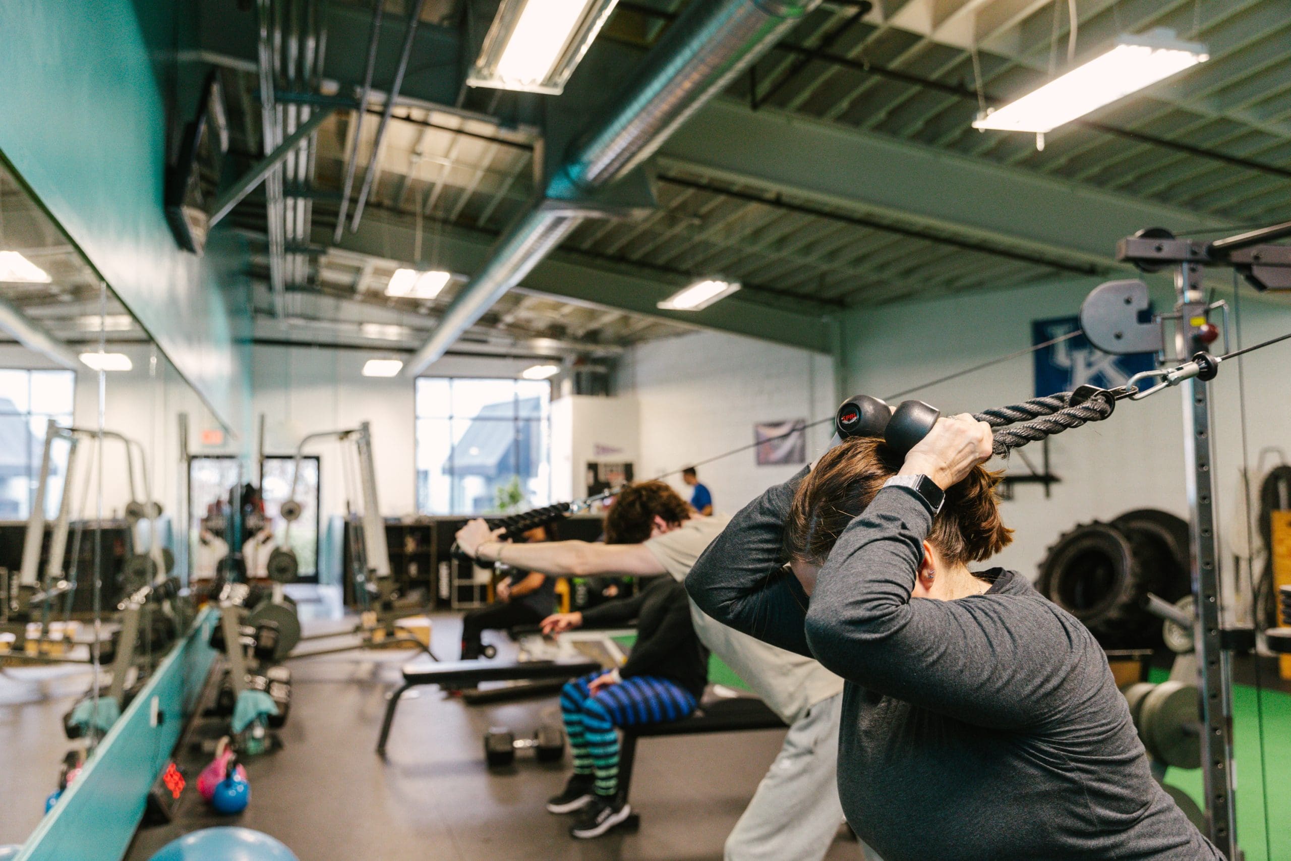 Group of people working out on machines